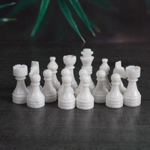 white and marinara chess pieces and chess board